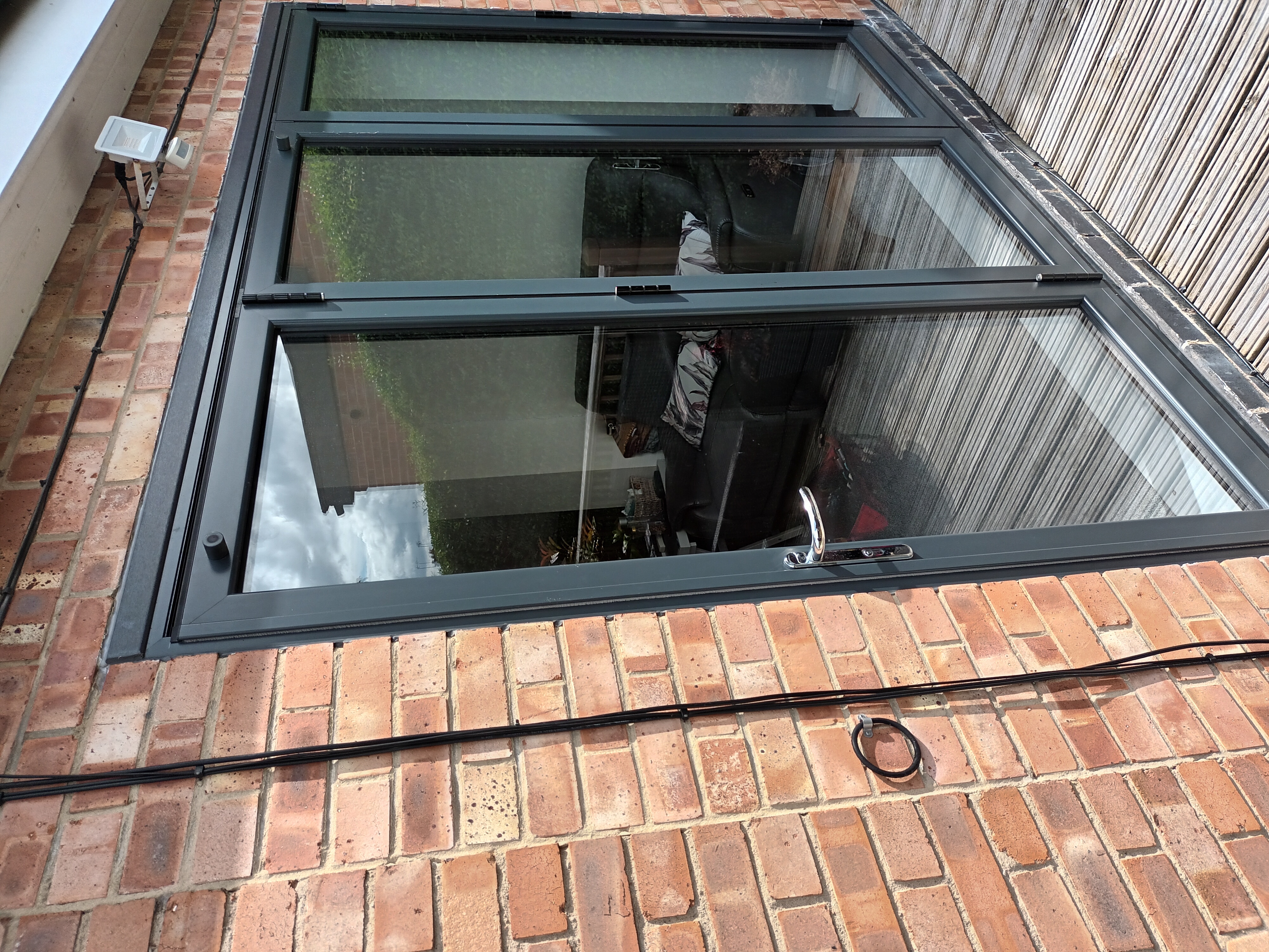 Bifold door repair and alignment on raised deck